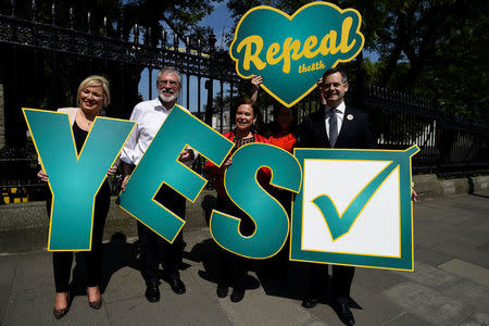 Sinn Fein's Michelle O'Neill, Gerry Adams, Mary Lou McDonald and Pearse Doherty hold Pro-Choice signs ahead of a 25th May referendum on abortion law, in Dublin, Ireland, May 23, 2018. REUTERS/Clodagh Kilcoyne