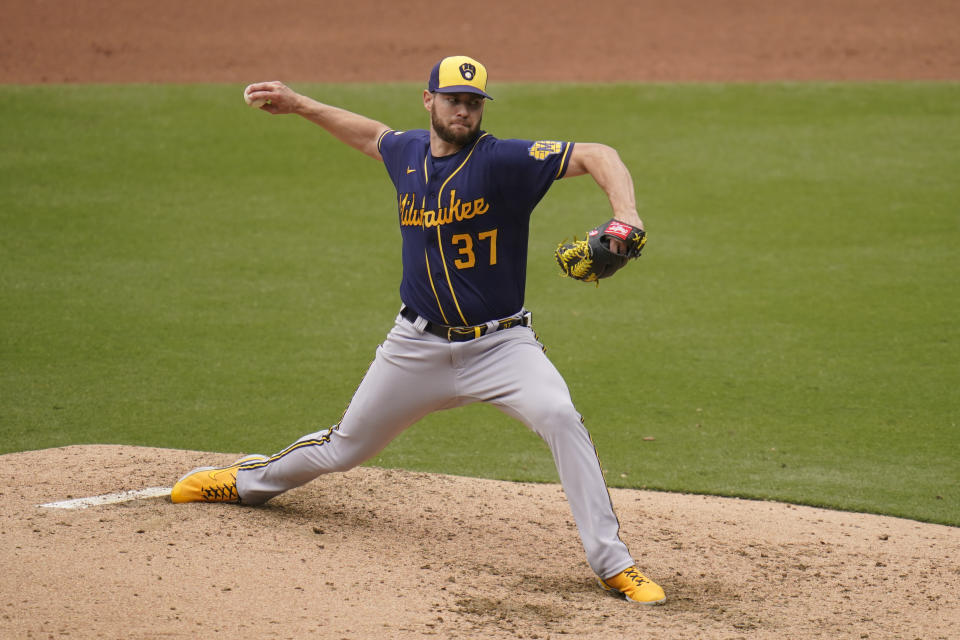 Milwaukee Brewers starting pitcher Adrian Houser works against a San Diego Padres batter during the fourth inning of a baseball game Wednesday, April 21, 2021, in San Diego. (AP Photo/Gregory Bull)