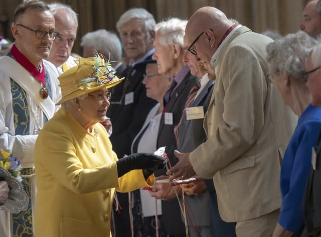 The Queen distributing Maundy money during last year's Royal Maundy Service at St George’s Chapel at Windsor Castle. Arthur Edwards/The Sun