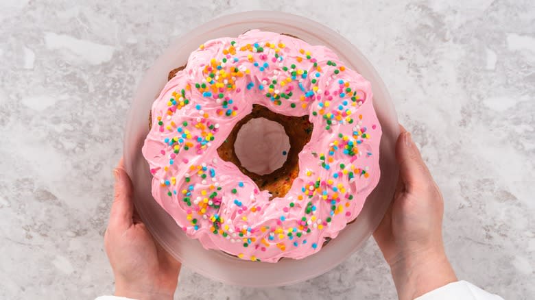 pink iced and sprinkled donut cake