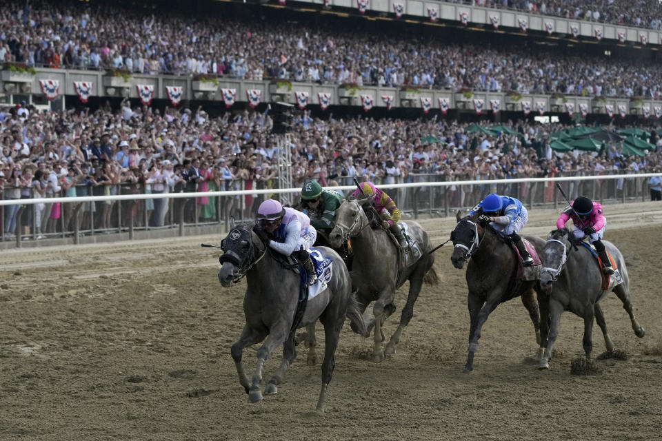 Arcangelo, with jockey Javier Castellano, crosses the finish line to win the 155th running of the Belmont Stakes horse race, Saturday, June 10, 2023, at Belmont Park in Elmont, N.Y. (AP Photo/Seth Wenig)