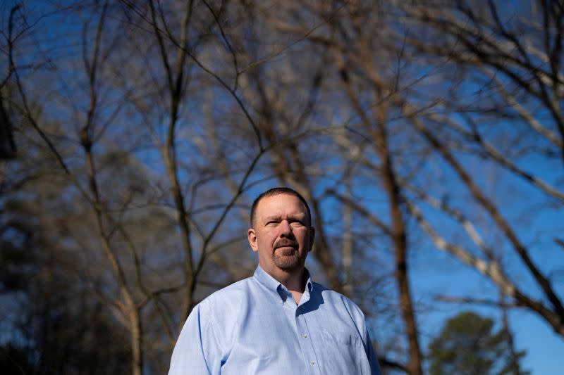 Randall Buchanan poses for a portrait at his home in Douglasville