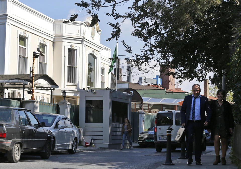 People walk past Saudi Arabia's consul's residence, in Istanbul, Wednesday, Oct. 10, 2018. A Turkish television station has aired surveillance video of missing writer Jamal Khashoggi walking into the Saudi Consulate in Istanbul and a black van leaving later for the consul's home. (AP Photo/Lefteris Pitarakis)