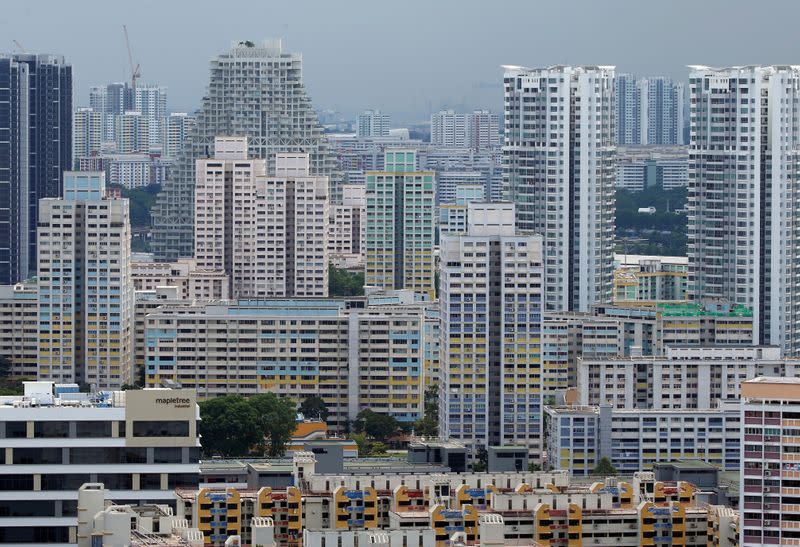 FILE PHOTO: A view of private residential apartments and public housing estates in Singapore