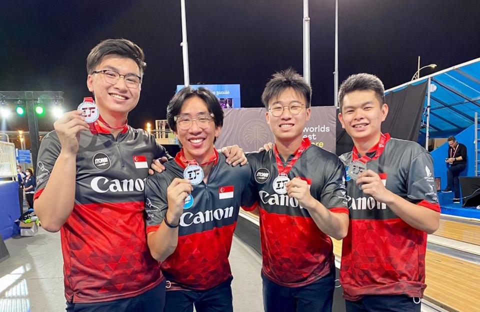 The Singapore national men's bowling team of (from left) Jonovan Neo, Jomond Chia, Cheah Ray Han and Darren Ong with their silver medal at the IBF Super World Championships in Dubai. (PHOTO: Singapore Bowling Federation)