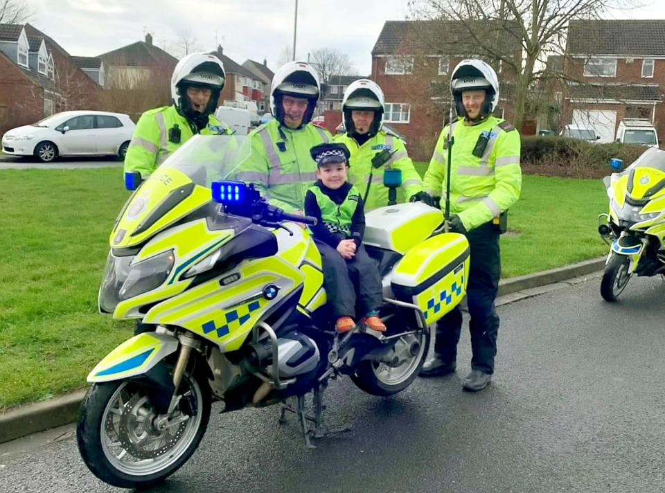 Durham Constabulary's Motorcycle Section surprised Harry at his home. (SWNS)