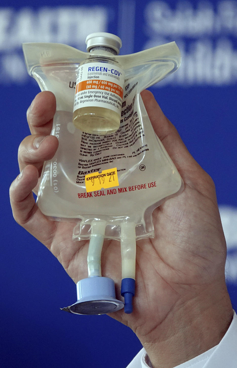 Dr. Aldo Calvo, Medical Director of Family Medicine at Broward Health, shows a Regeneron monoclonal antibody infusion bag during a news conference Thursday, Aug. 19, 2021 at the Hospital in Fort Lauderdale, Fla. (Joe Cavaretta/South Florida Sun-Sentinel via AP)