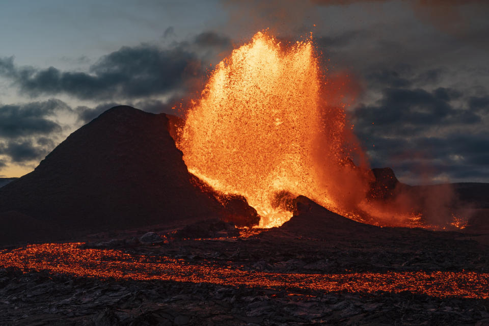 Lava flows from an eruption of the Fagradalsfjall volcano on the Reykjanes Peninsula in southwestern Iceland on Tuesday, May 11, 2021. (AP Photo/Miguel Morenatti)