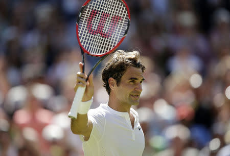 Roger Federer of Switzerland celebrates after winning his match against Samuel Groth of Australia at the Wimbledon Tennis Championships in London, July 4, 2015. REUTERS/Henry Browne