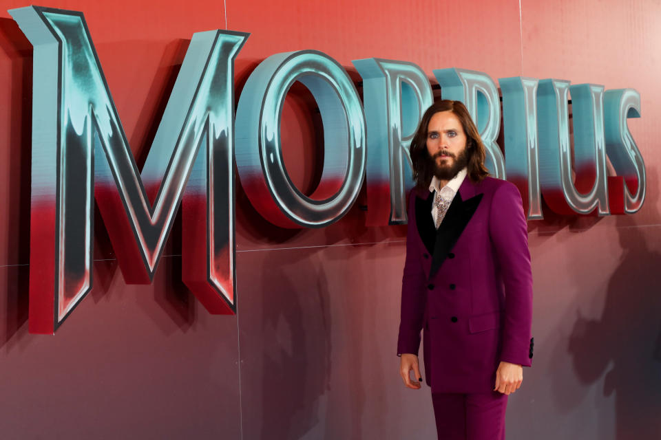 Jared at the Morbius premiere, wearing a plum coloured suit with black lapels