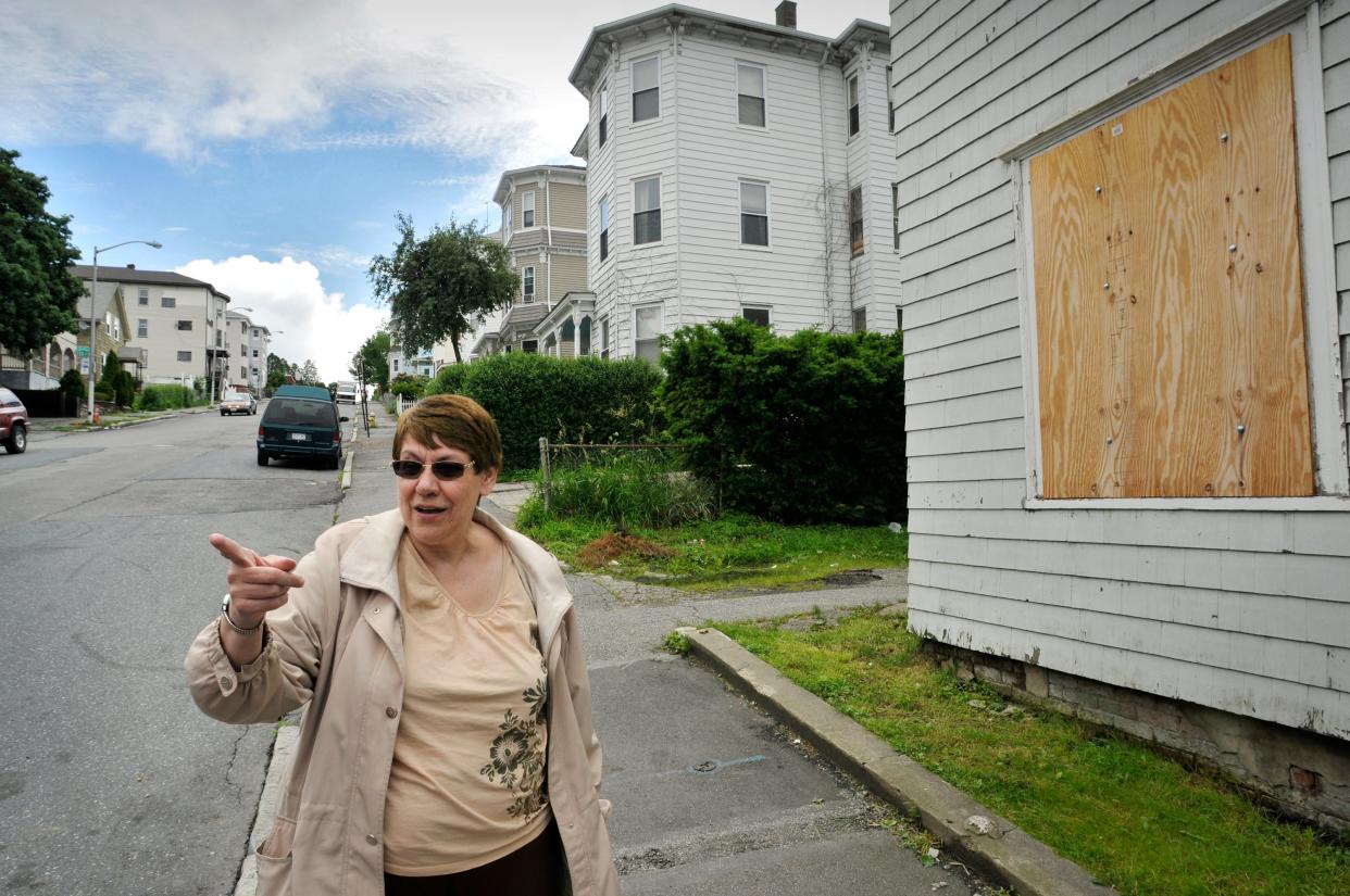 Life-long Dorchester Street resident Lorraine Laurie of Worcester talks about the neighborhood while standing on Dorchester Street  in 2013.