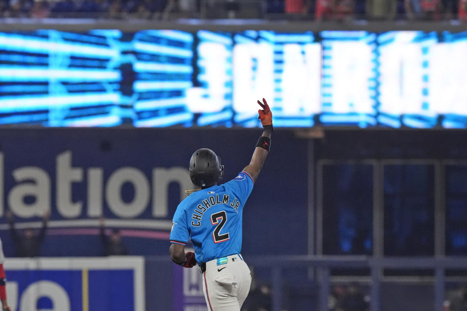 Miami Marlins' Jazz Chisholm Jr. celebrates as he rounds second base after hitting a grand slam during the first inning of a baseball game against the Washington Nationals, Sunday, April 28, 2024, in Miami. Chisholm, Luis Arraez, Bryan De La Cruz and Josh Bell scored on the play. (AP Photo/Wilfredo Lee)