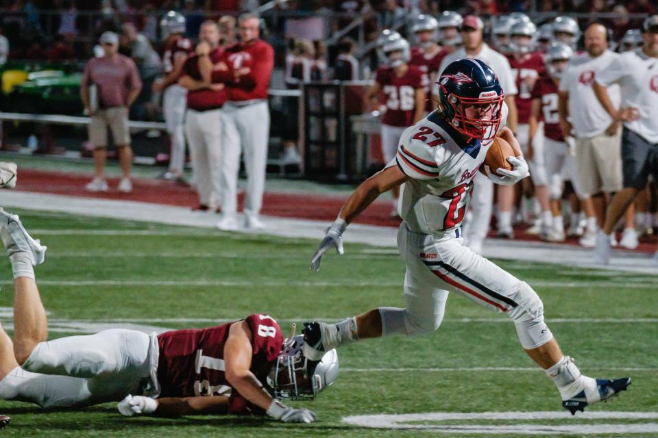 Indian Valley's Gavin Henry breaks the tackle of Ben Hamm, Friday, Sept. 2 at the Brick House.