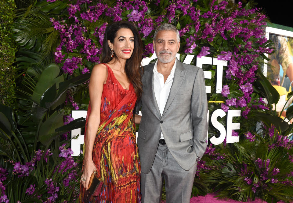 Amal Clooney, George Clooney at "Ticket to Paradise" premiere held at the Regency Village Theatre on October 17, 2022 in Los Angeles, California.