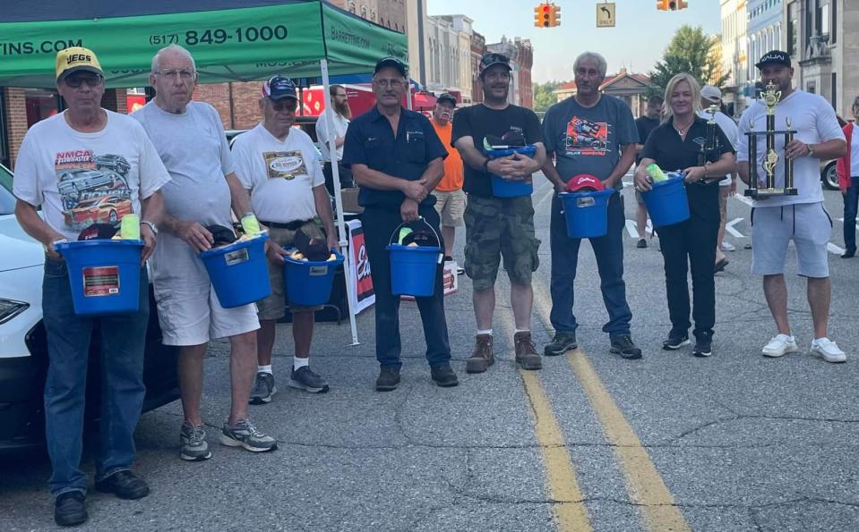 The winners of this year's Summer in the City Car Show pose for a photo.