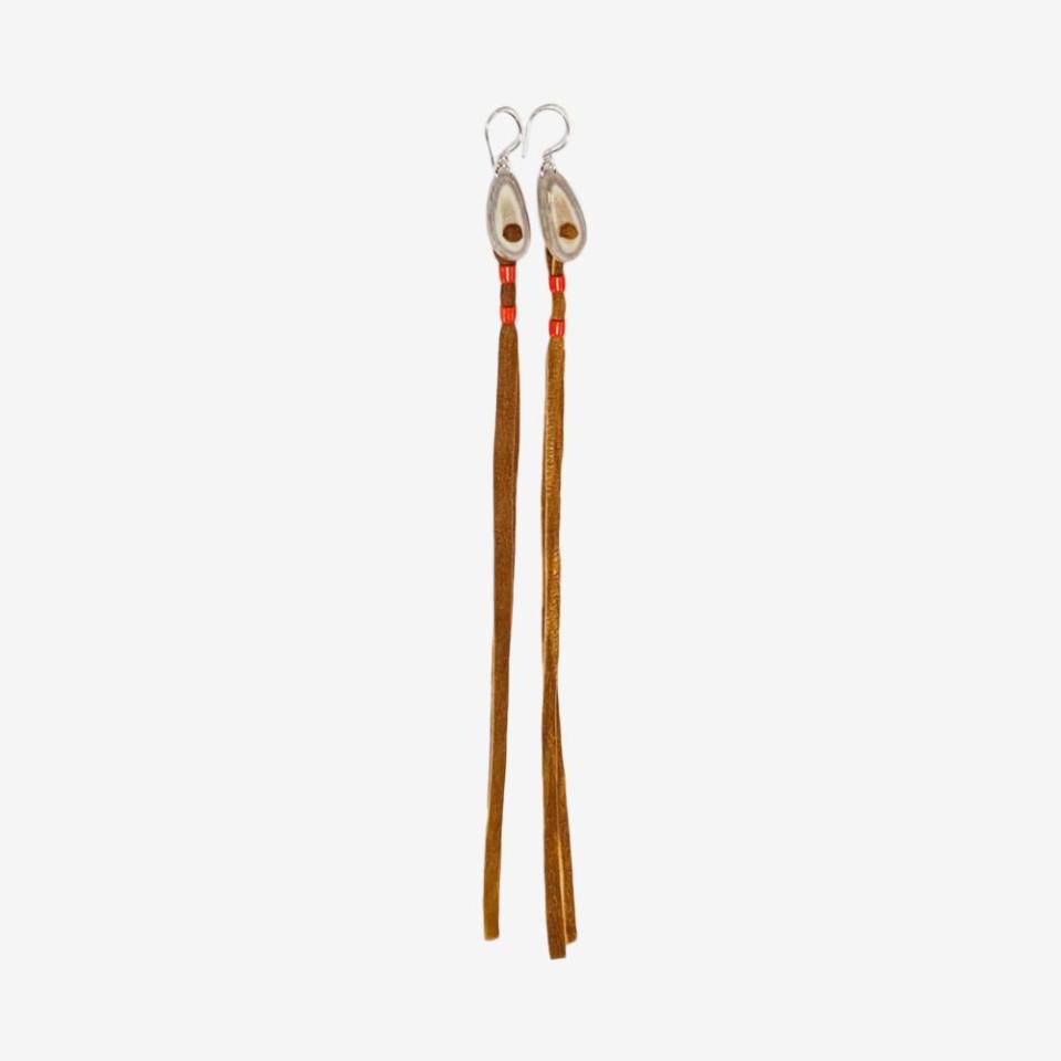 <p><a href="https://tanialarsson.com/collections/shop/products/long-caribou-hide-earrings-5" rel="nofollow noopener" target="_blank" data-ylk="slk:Shop Now;elm:context_link;itc:0;sec:content-canvas" class="link ">Shop Now</a></p><p>Long Caribou Hide Earrings</p><p>tanialarsson.com</p><p>365.00</p>