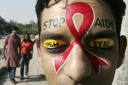 A volunteer from the AIDS control society takes part in a campaign for AIDS awareness programme in Chandigarh October 28, 2007. REUTERS/Ajay Verma/Files