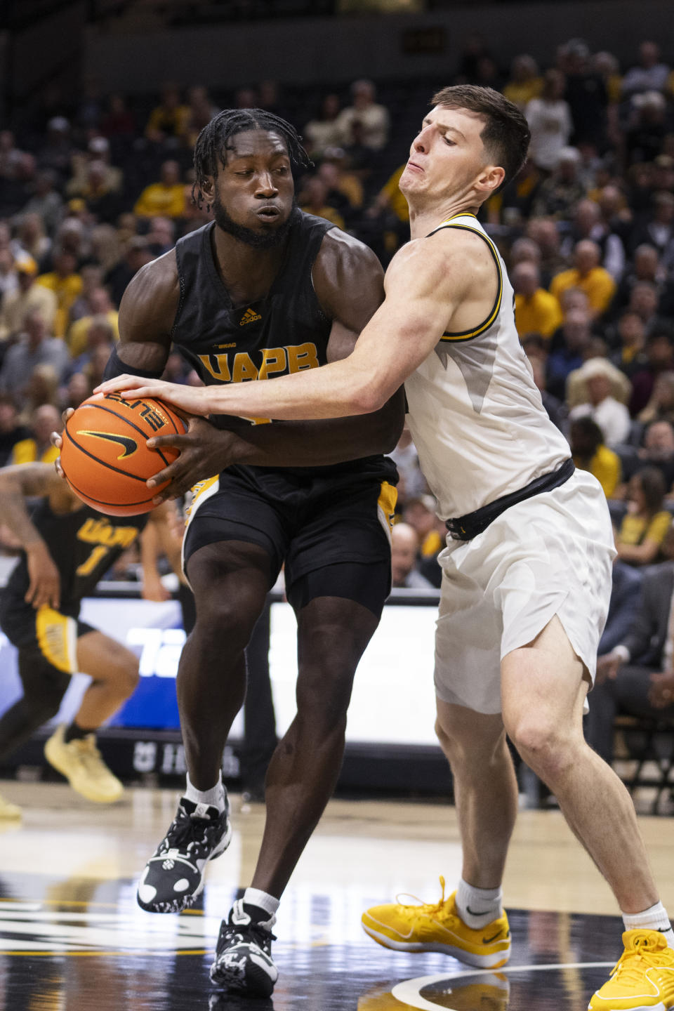 Missouri forward Jesus Carralero Martin, right, knocks the ball from Arkansas-Pine Bluff's Ismael Plet, left, during the first half of an NCAA college basketball game Monday, Nov. 6, 2023, in Columbia, Mo. (AP Photo/L.G. Patterson)