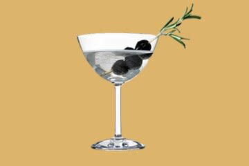 martini with sprig on yellow background