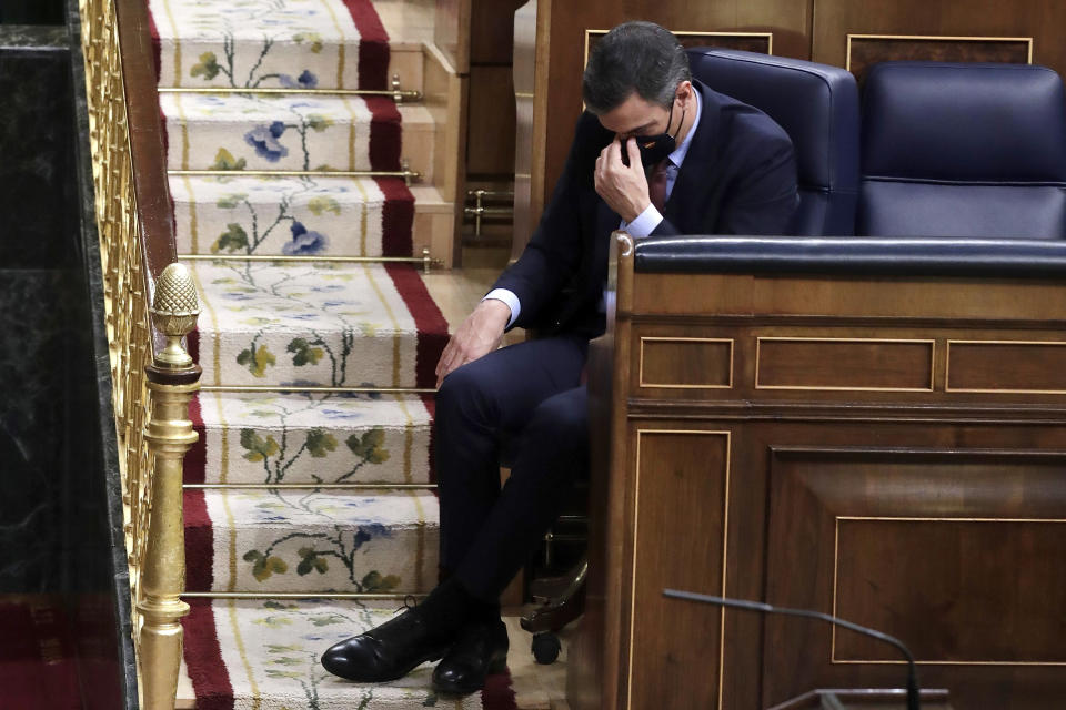 Spain's Prime Minister Pedro Sanchez listens to a speech by Vox party leader Santiago Abascal during a parliamentary session in Madrid, Spain, Oct. 21, 2020. Spanish Prime Minister Pedro Sánchez says that he will consider resigning after what he calls “spurious” corruption allegations against his wife led to a judicial investigation being opened on April 24, 2024. Sánchez said in a letter posted on his X account that while the allegations against his wife Begoña Gómez are false, he is canceling his public agenda until Monday when he announce whether he will continue or step down. (AP Photo/Manu Fernandez, File)