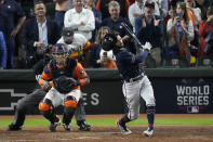 Atlanta Braves' Dansby Swanson strikes out to end Game 2 of baseball's World Series between the Houston Astros and the Atlanta Braves Wednesday, Oct. 27, 2021, in Houston. The Astros won 7-2, to tie the series 1-1. (AP Photo/Sue Ogrocki)