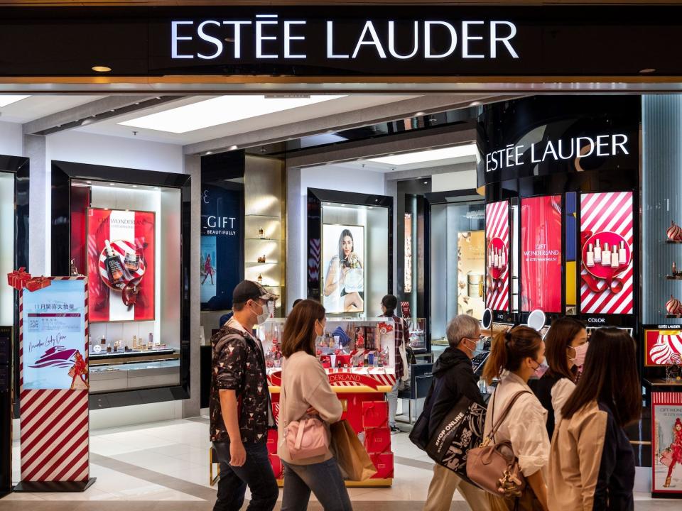 Pedestrians walk past the American multinational skincare, and beauty products brand, Estée Lauder  logo seen in Hong Kong.