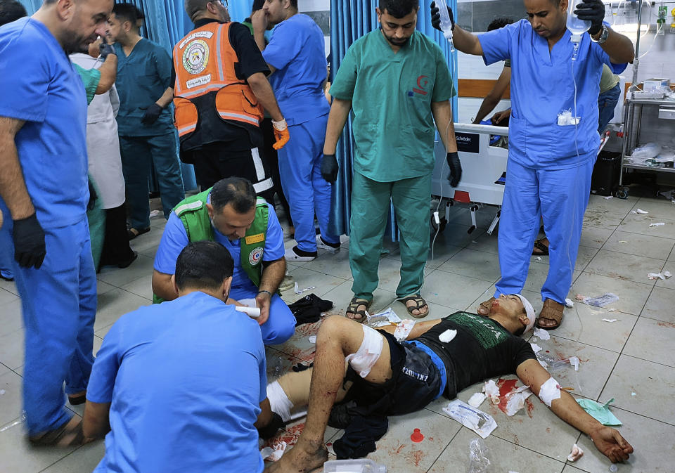 FILE - A wounded Palestinian man receives treatment at Kama Adwan hospital following Israeli bombardment on a UN school used as shelter, in Jabaliya, on the outskirts of Gaza City, Thursday, Nov. 2, 2023. Weeks after ordering northern Gaza's 1.1 million inhabitants to evacuate south, the Israeli army is intensifying its bombing of the area that stretches to the wetlands of Wadi Gaza. Israeli soldiers are also battling Hamas militants just north of Gaza City. It's the start of what officials expect to be a long and bloody invasion that has already pinned down hundreds of thousands of Palestinians who remain in the north. (AP Photo/Abdul Qader Sabbah, File)