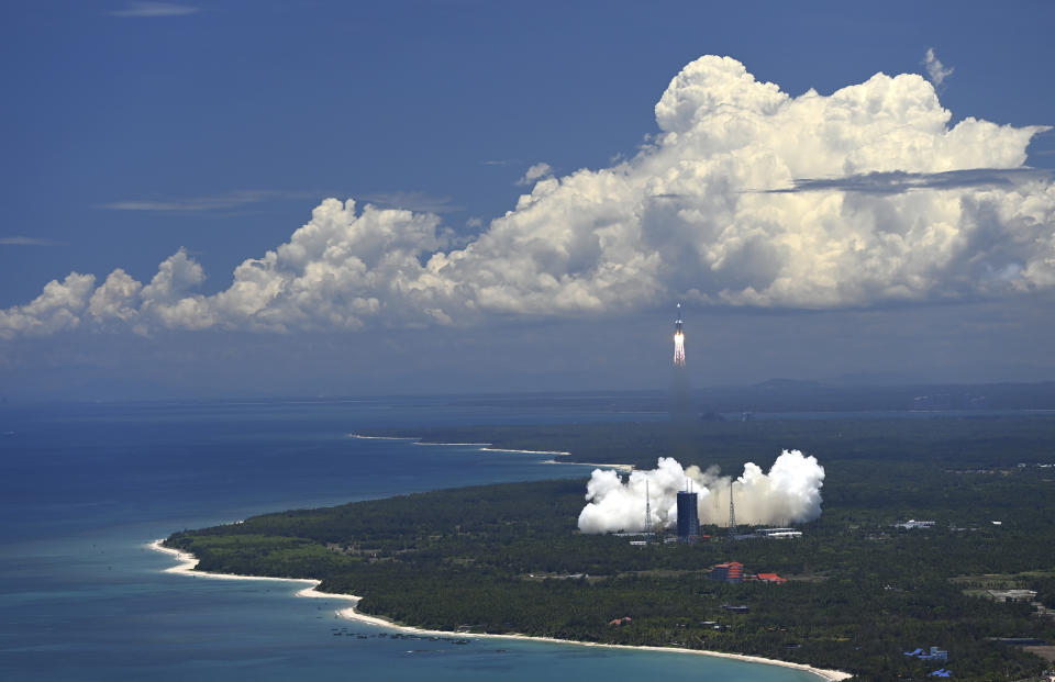 FILE - In this Thursday, July 23, 2020 photo released by China's Xinhua News Agency, a Long March-5 rocket carrying the Tianwen-1 Mars probe lifts off from the Wenchang Space Launch Center in southern China's Hainan Province. (Guo Cheng/Xinhua via AP)