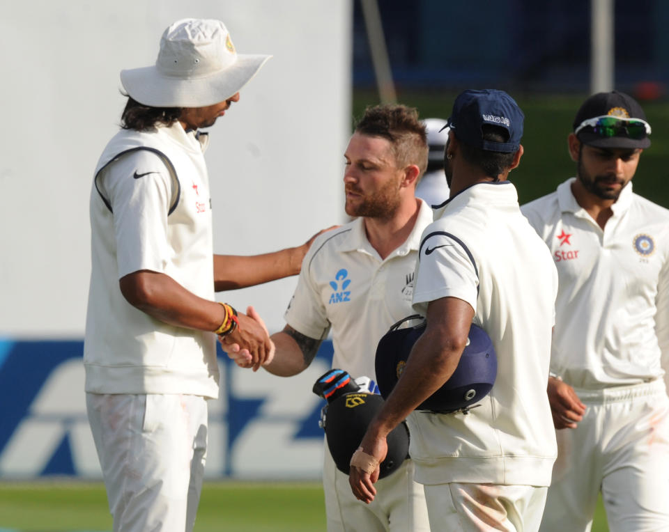 India’s Ishant Sharma, left, shakes hands with New Zealand’s Brendon McCullum at the end of play as he reached his highest score of 281 on the fourth day of their second cricket test mat at Basin Reserve in Wellington, New Zealand, Monday, Feb. 17, 2014. (AP Photo/SNPA, Ross Setford) NEW ZEALAND OUT