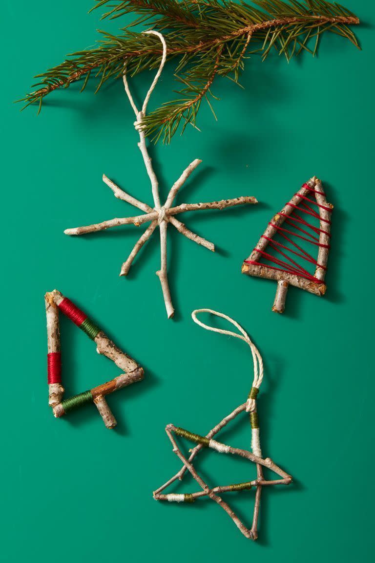 <p>This craft comes with an adventure: First, take a foraging walk outside to gather twigs. Then, use glue to create holiday shapes and finish with festive embroidery thread wrapping.</p>