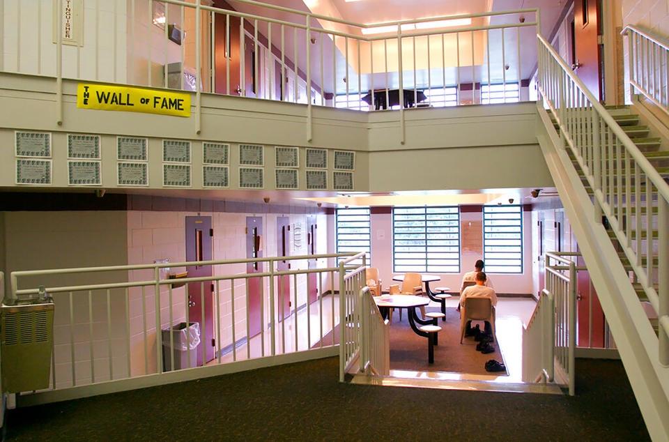 In this May 18, 2004 photo, inmates sit in one of the cottages at the Circleville Juvenile Correctional Facility in Circleville, Ohio. A report released Friday April 23, 2021 that looked at the death of 17-year-old Robert Wright in August of 2020, indicated that two juvenile prison guards slept while on duty. One of them failed to properly conduct overnight rounds, and two others failed to conduct timely CPR on the Ohio youth found unresponsive who later died, according to an investigation into the youth's death.<span class="copyright">Tim Revell—The Columbus Dispatch/AP</span>