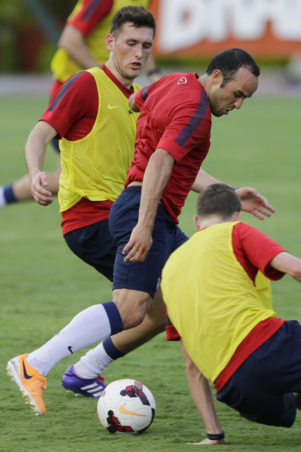 United States' Landon Donavan fights for the ball with Matt Besler, left, during a training session in Sao Paulo, Brazil, Tuesday, Jan. 14, 2014. The US national soccer team is on a training program in Sao Paulo preparing for the World Cup tournament, which gets underway on June. (AP Photo/Nelson Antoine)