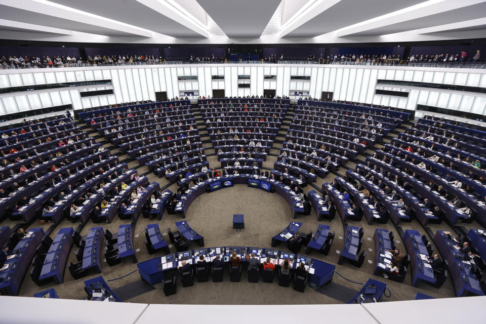 Members of European parliament vote for a new law binding annual greenhouse gas emission reductions by Member States, Tuesday, March 14, 2023 in Strasbourg, eastern France. (AP Photo/Jean-Francois Badias)