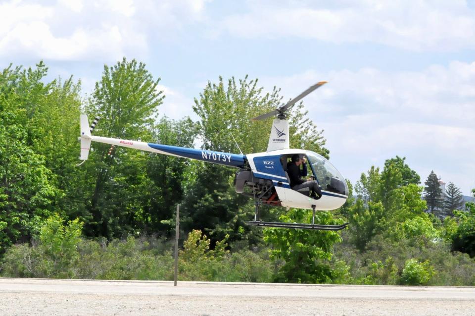 A helicopter takes off Tuesday in the search for signs of Everette Jackson, a 21-year-old Raceland man who fell into the Payette River in Emmett, Idaho, while tubing Saturday.