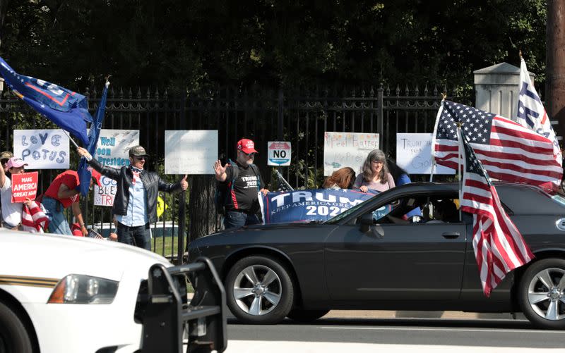 Supporters rally in support of U.S. President Donald Trump outside of the Walter Reed National Military Medical Center in Bethesda