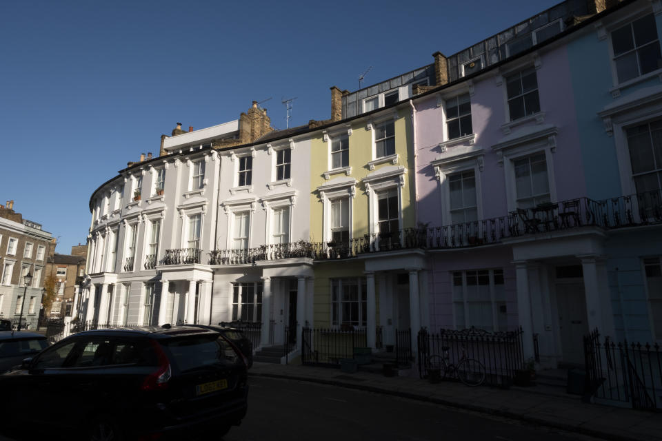 Rows of coloured residential townhouses stand on a crescent in the Primrose Hill area of London, U.K., on Friday, Nov. 29, 2019. Photo: Bryn Colton/Bloomberg