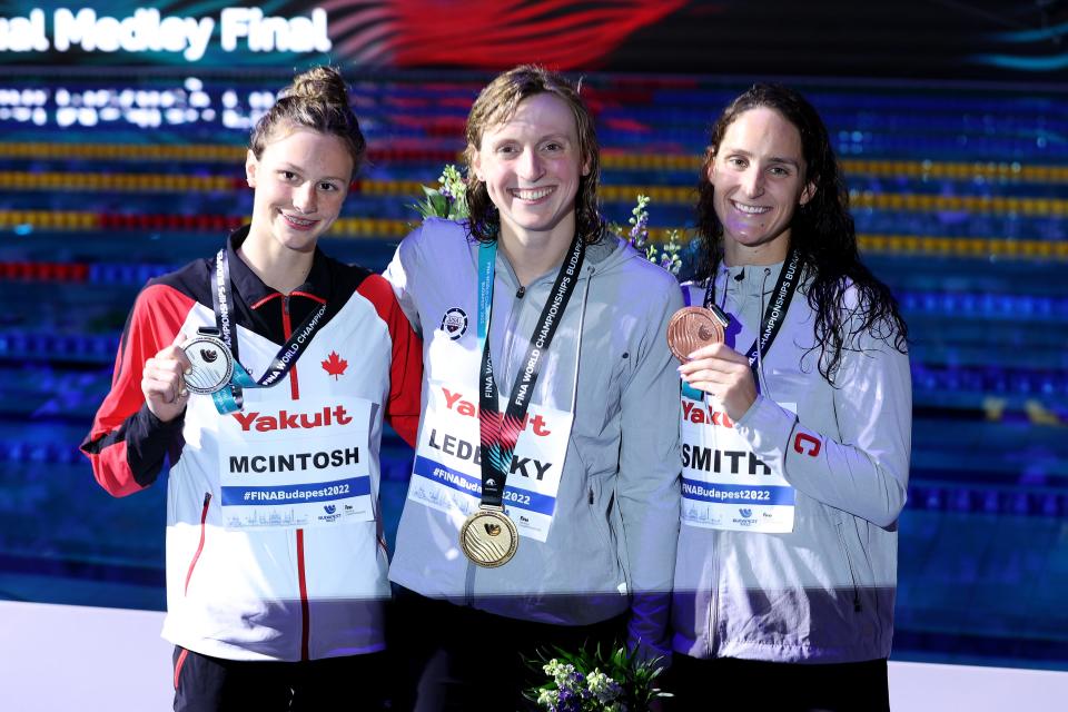 Summer McIntosh (left) and Katie Ledecky (middle) celebrate after the women's 400-meter freestyle final on June 18.