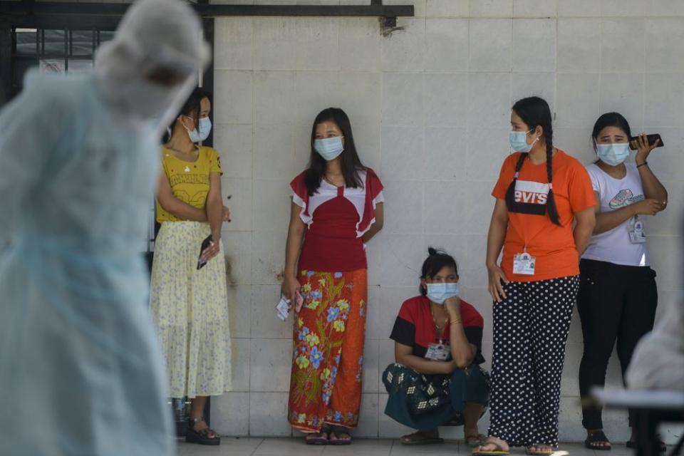 Foreign workers wait to get tested for Covid-19 at Top Glove’s female staff dormitory in Klang November 18, 2020. — Picture by MIera Zulyana