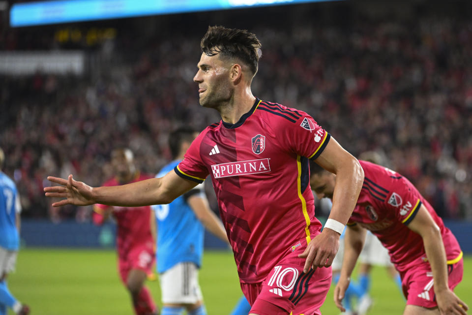 St. Louis City SC midfielder Eduard Lowen (10) reacts after scoring on a penalty kick against Charlotte FC during the first half of an MLS soccer match Saturday, March 4, 2023, in St. Louis. (AP Photo/Joe Puetz)