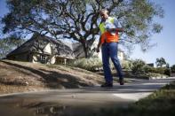 Enrique Silva, Department of Water and Power (DWP) Water Conservation Response Unit supervisor, patrols the streets looking for people wasting water during the drought in Los Angeles, California, April 17, 2015. REUTERS/Lucy Nicholson