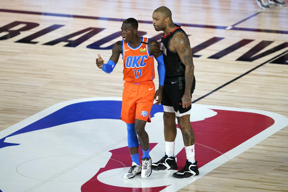 Houston Rockets' P.J. Tucker, right, confronts Oklahoma City Thunder's Dennis Schroder (17) after a foul during the second half of an NBA basketball first round playoff game Saturday, Aug. 29, 2020, in Lake Buena Vista, Fla. Both players were ejected. (AP Photo/Ashley Landis)
