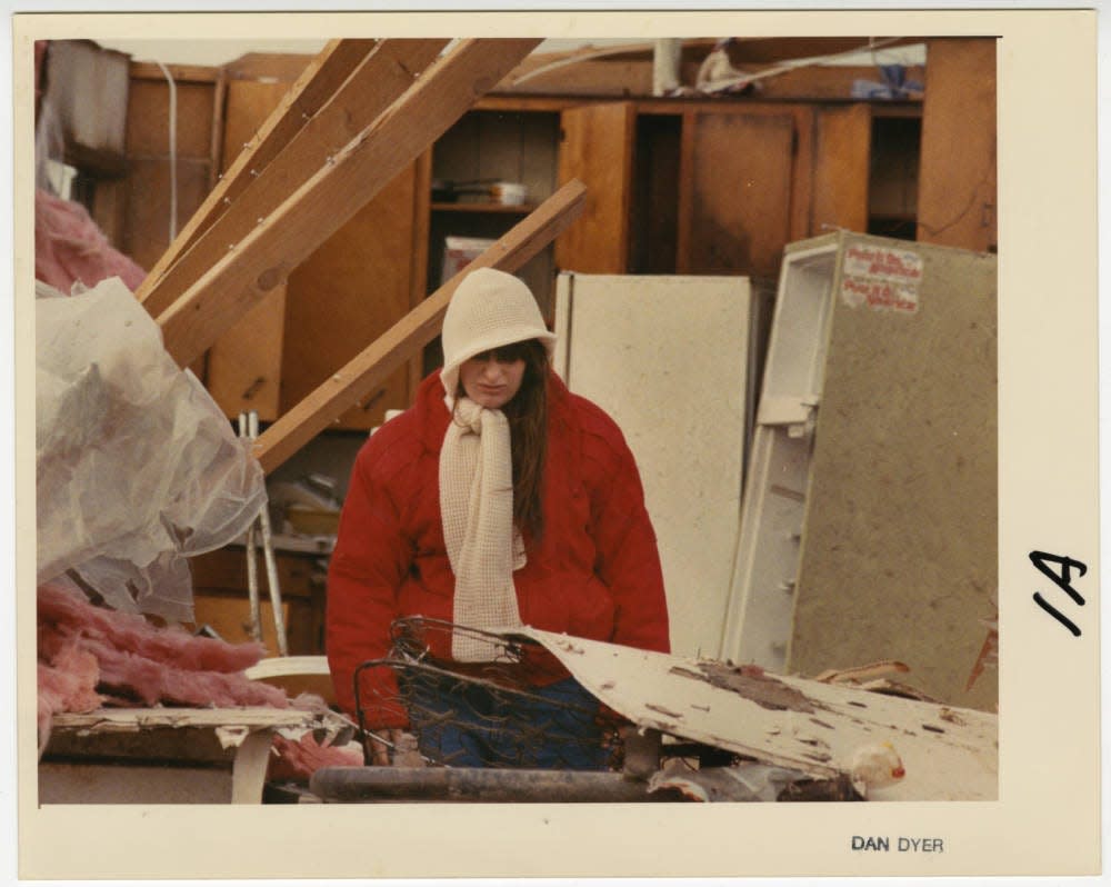 Standing in her former kitchen, Melissa Wogoman assesses the damage caused by a tornado in Butterfield, Missouri on November 15, 1988.