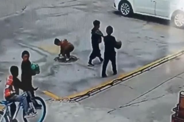 Manhole explosion sends Chinese boy flying into air after he throws firecracker inside