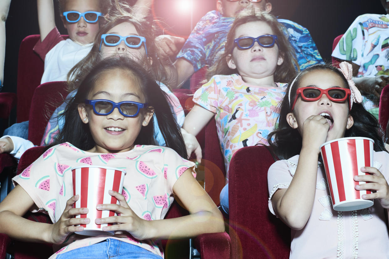 Group of children enjoying a movie at the cinema