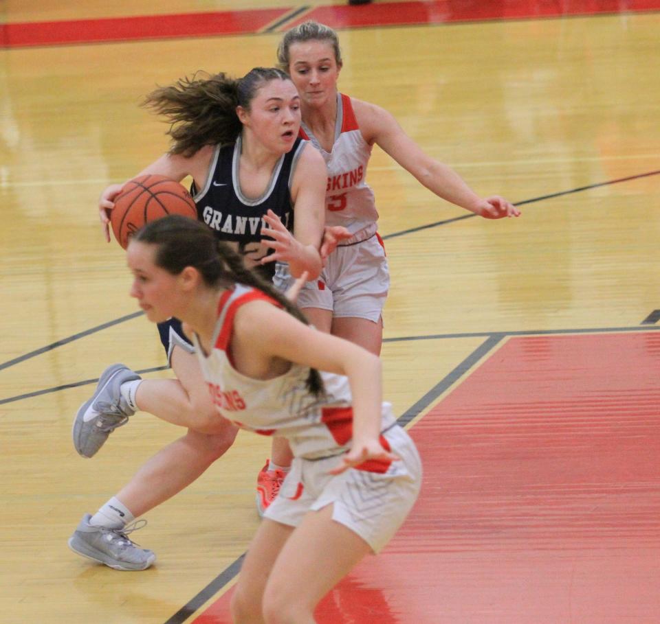 Granville's Katie Cottrell drives against Utica's Emily Meyers during the visiting Blue Aces' 68-26 victory on Wednesday.