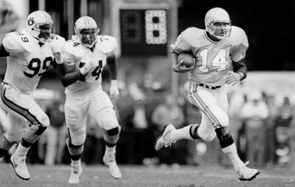 North Carolina quarterback Mark Maye (14) runs the ball against Auburn on October 3, 1987 at Kenan Stadium in Chapel Hill, N.C.