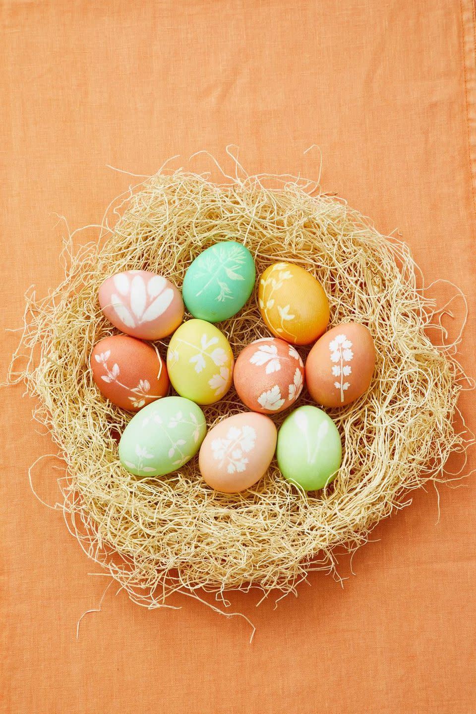 <p>Natural herbs like thyme and sage make the most beautiful patterns for your Easter eggs. Once you're finished decorating, toss the eggs in a fake nest for an unforgettable display.</p><p><strong><em><a href="https://www.womansday.com/home/crafts-projects/g2216/easter-eggs/?slide=10" rel="nofollow noopener" target="_blank" data-ylk="slk:Get the Dipped Herb Silhouettes tutorial.;elm:context_link;itc:0;sec:content-canvas" class="link ">Get the Dipped Herb Silhouettes tutorial.</a></em></strong></p><p><strong><a class="link " href="https://www.amazon.com/Round-Artificial-Moss-Nest-Ornament/dp/B00IMN9MGU/?tag=syn-yahoo-20&ascsubtag=%5Bartid%7C10070.g.1751%5Bsrc%7Cyahoo-us" rel="nofollow noopener" target="_blank" data-ylk="slk:SHOP ARTIFICIAL MOSS NESTS;elm:context_link;itc:0;sec:content-canvas">SHOP ARTIFICIAL MOSS NESTS</a></strong></p>