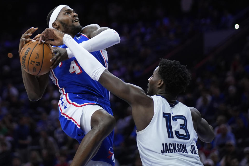 Memphis Grizzlies' Jaren Jackson Jr., right, blocks a shot by Philadelphia 76ers' Paul Reed during the first half of an NBA basketball game, Wednesday, March 6, 2024, in Philadelphia. (AP Photo/Matt Slocum)