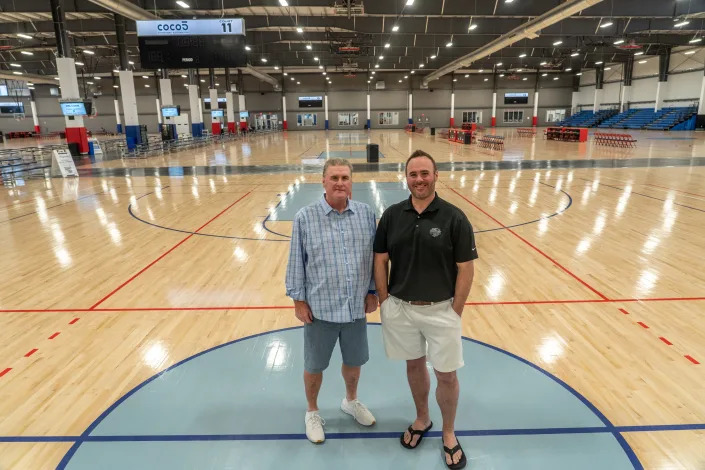 Randy Miller, founder and chairman of Legacy Sports USA (left), and Chad Miller, CEO of Legacy Sports USA, pose for a portrait at Legacy Park: Arizona&#x002019;s Premiere Sports &amp; Entertainment Complex in Mesa on March 29, 2023.