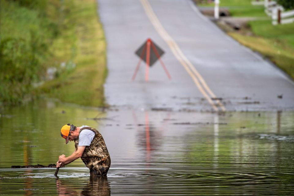 Aug 21, 2021; Dickson, TN, USA; Dickson Public Works personnel check the flooding on Old Pond Lane following heavy rainfall on Saturday, Aug. 21, 2021, in Dickson, Tenn.